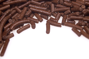 Image showing 
chocolate sprinkles on white background. frame