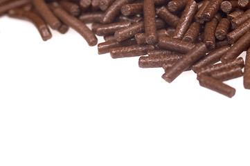 Image showing 
chocolate sprinkles on white background. frame