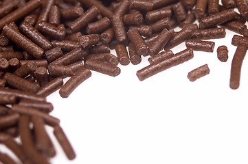 Image showing 
chocolate sprinkles on white background. frame