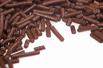 Image showing 
chocolate sprinkles on white background. frame