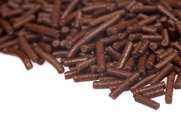 Image showing 
chocolate sprinkles on white background. frame