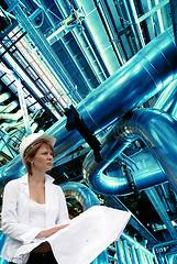 Image showing woman engineer pipes, tubes, machinery and steam turbine at a po