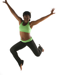 Image showing young pretty hispanic african american woman exercising with fit