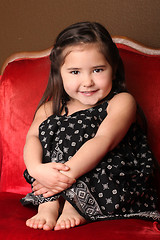 Image showing Sweet Young Child Sitting in a Chair