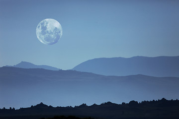 Image showing Ghostly Mountain Silhouettes and Moon