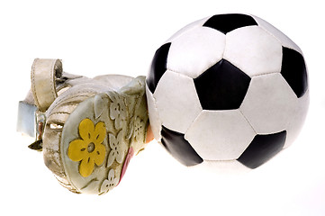 Image showing Baby football shoes and ball on white background