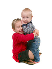 Image showing Young Brothers Hugging Eachother