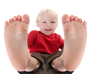 Image showing Silly Baby Boy Lying on His Back Laughing
