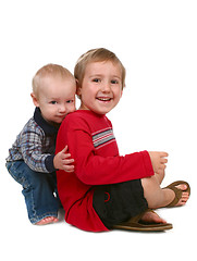 Image showing Two Brothers Smiling and Sitting Together