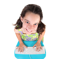 Image showing Cute Little Girl Typing on a Computer Keyboard