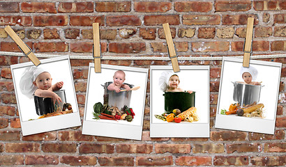 Image showing Baby Chefs in Pots Hanging on Film Blanks Against Brick