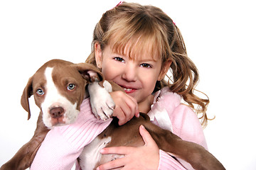 Image showing Adorable Little Girl Holding Her Puppy