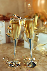 Image showing Celebration of an Event With Champagne Glasses and Gifts