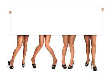 Image showing Womens Legs Holding up a Blank Sign