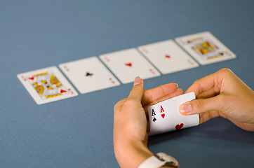 Image showing 2 aces in hand and 3 on the table
