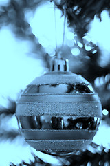 Image showing Christmas ornaments on tree.