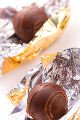 Image showing two opened foil candies