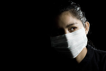 Image showing protective face mask on asian woman