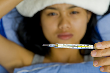 Image showing pretty young woman sick in bed