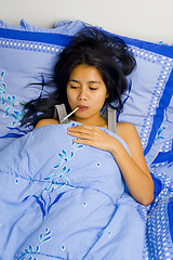 Image showing pretty young woman sick in bed