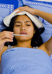 Image showing pretty young woman sick in bed