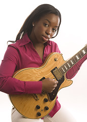 Image showing young hispanic black woman playing electric guitar