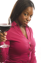 Image showing attractive dark hispanic woman toasting with glass of wine