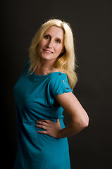 Image showing glamorous woman posing in cocktail dress