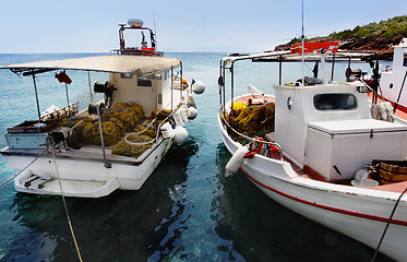 Image showing Fishing boats docked at a harbor