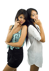 Image showing pretty asians with mobile phones