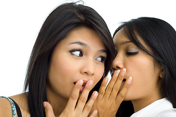 Image showing two young asian friends gossip