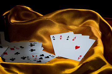 Image showing 4 aces on golden silk