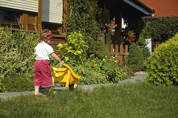 Image showing little girl having fun in garden