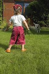 Image showing little girl with best friend and carrot