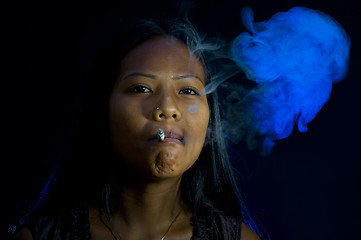 Image showing pretty woman smoking