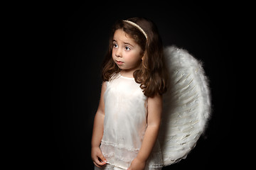 Image showing Pretty little angel looking sideways