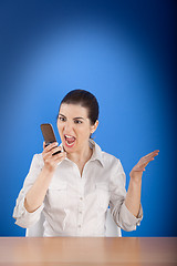 Image showing Angry woman calling at phone