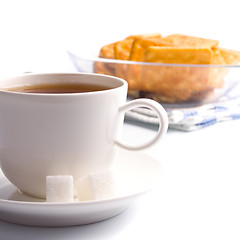 Image showing cup of tea, sugar and cookies