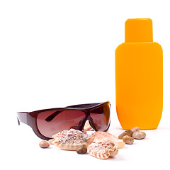 Image showing sunglasses and lotion