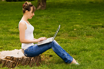 Image showing Young woman on the stub with notebook