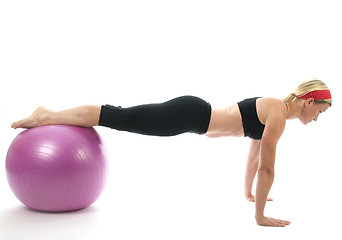 Image showing illustration pose middle age woman push up bars and fitness core