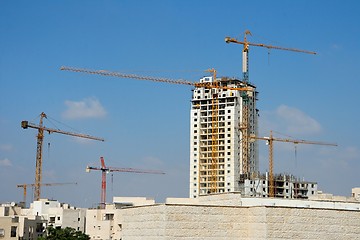 Image showing Six lifting cranes at construction site