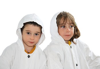 Image showing Cute preschool boy and girl in white hooded cloaks isolated