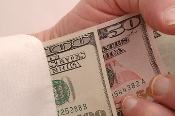 Image showing money up the sleeve