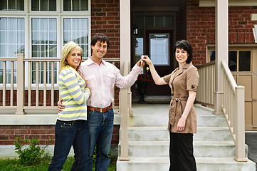 Image showing Happy couple with real estate agent