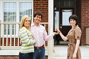 Image showing Happy couple with real estate agent