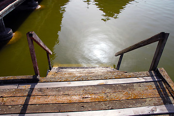 Image showing Wooden stairs into water