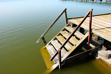 Image showing Wooden stairs into water