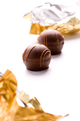 Image showing two foil opened sweets