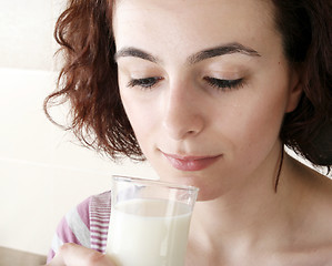 Image showing Young people eating milk with cereals